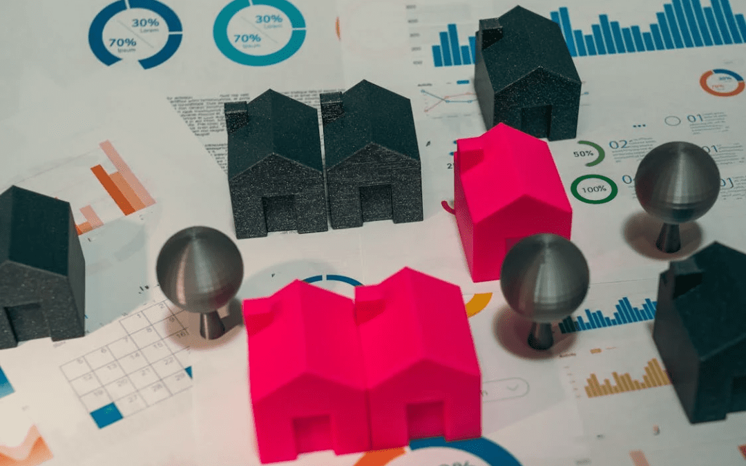 Data charts and miniature house models representing growth trends and strategic planning in the new homes sector, highlighting market strength & resilience.